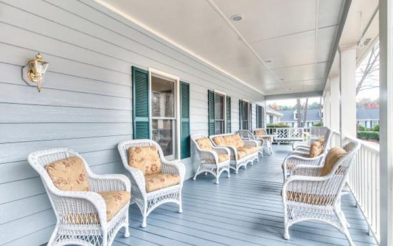 a patio with chairs and tables